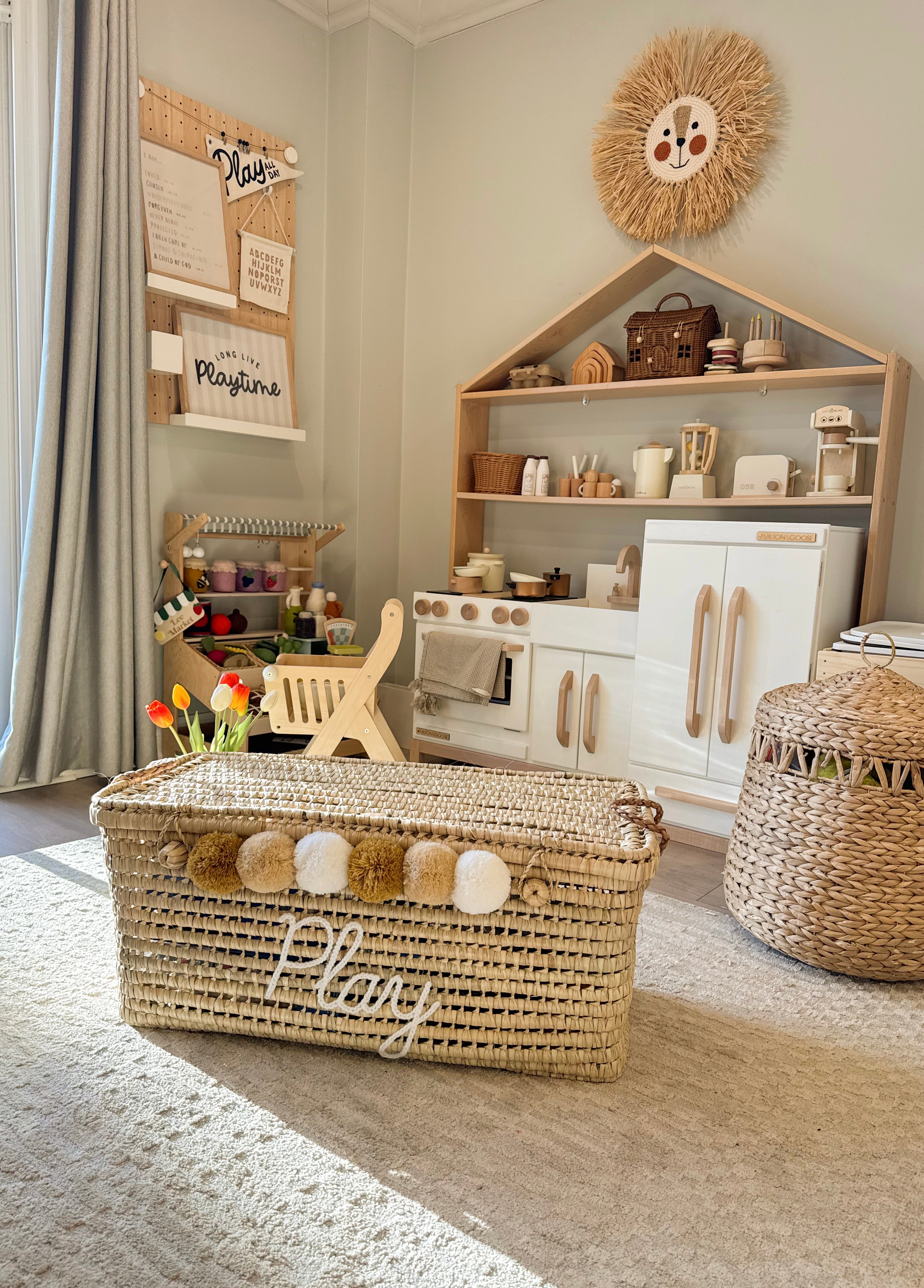 Montessori inspired nursery organization with a custom wicker storage chest.