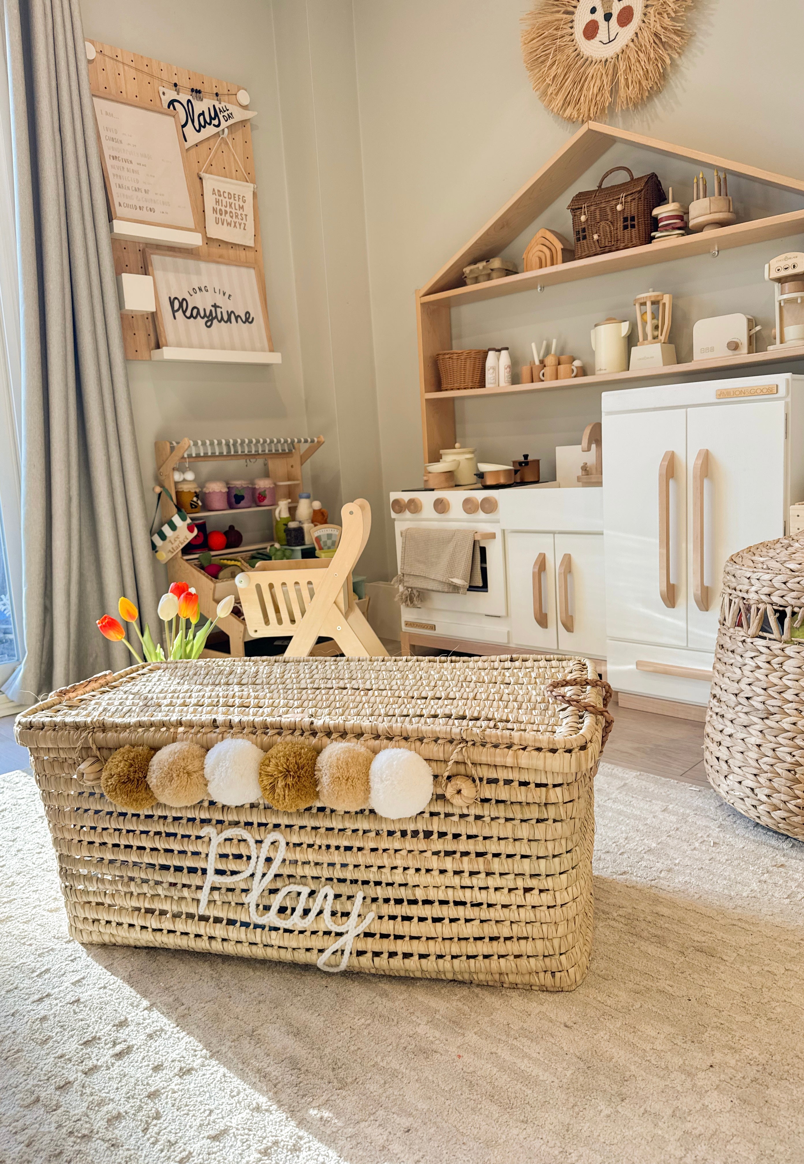 Detail of personalized name embroidered in wool on a Moroccan wicker basket.